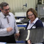 Sen. Deb Fischer inspects a composite part