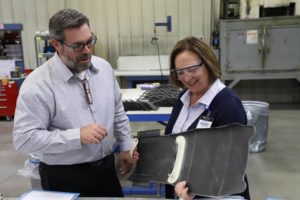 Sen. Deb Fischer inspects a composite part